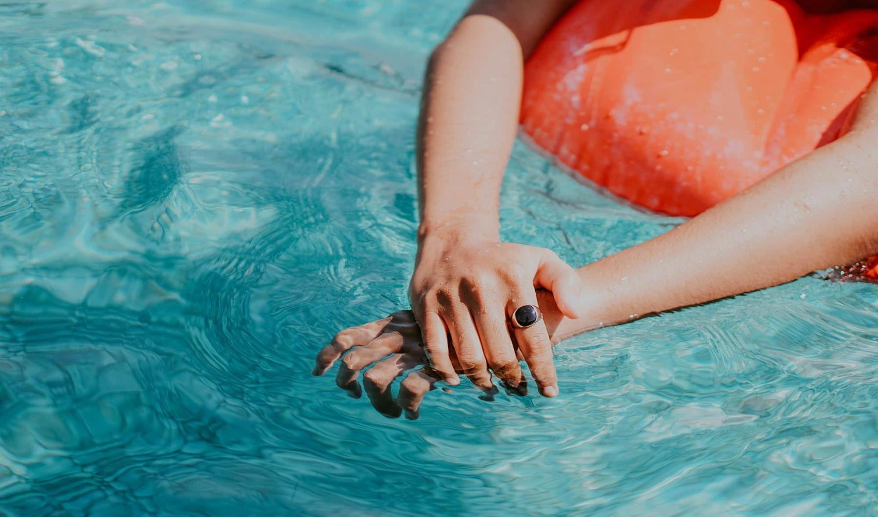 Relax and unwind poolside woman relaxes on a floatie in swimming pool