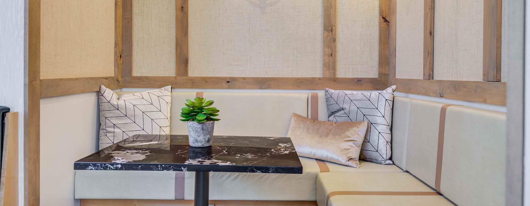 a desk with a table and a plant on it