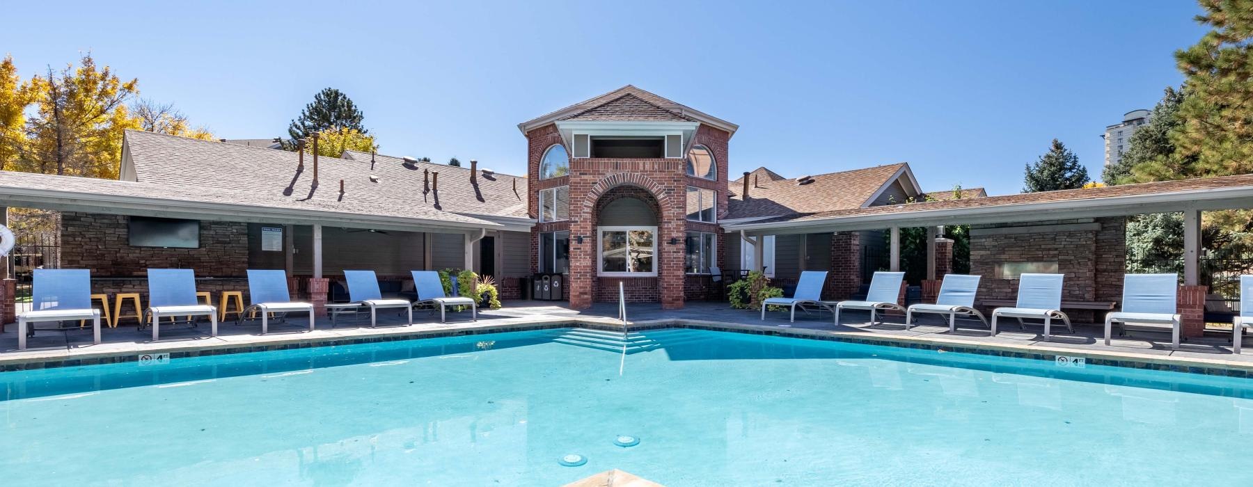 a pool with chairs around it