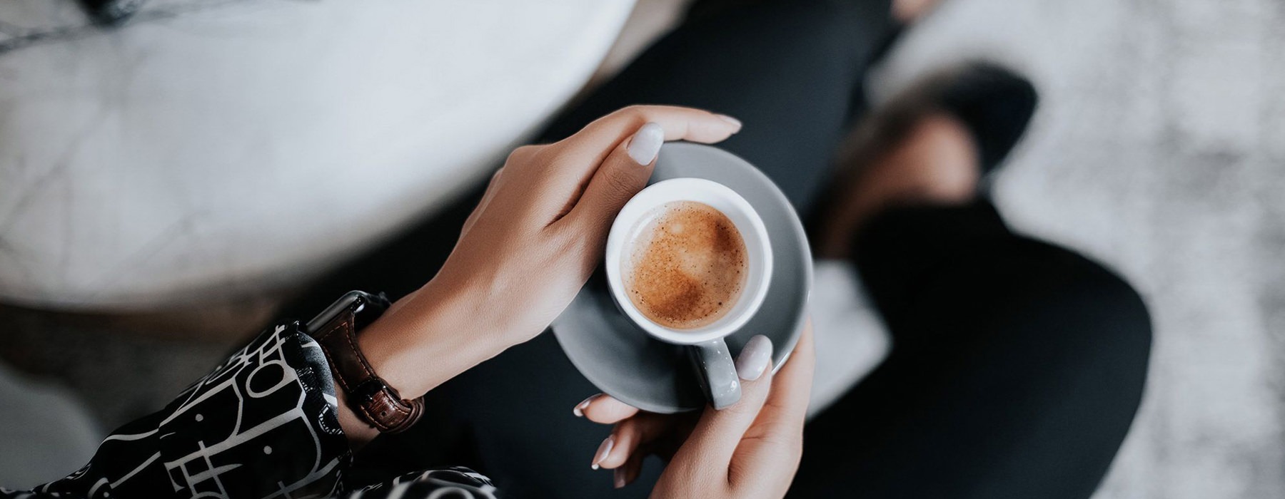 woman holding a cup of coffee