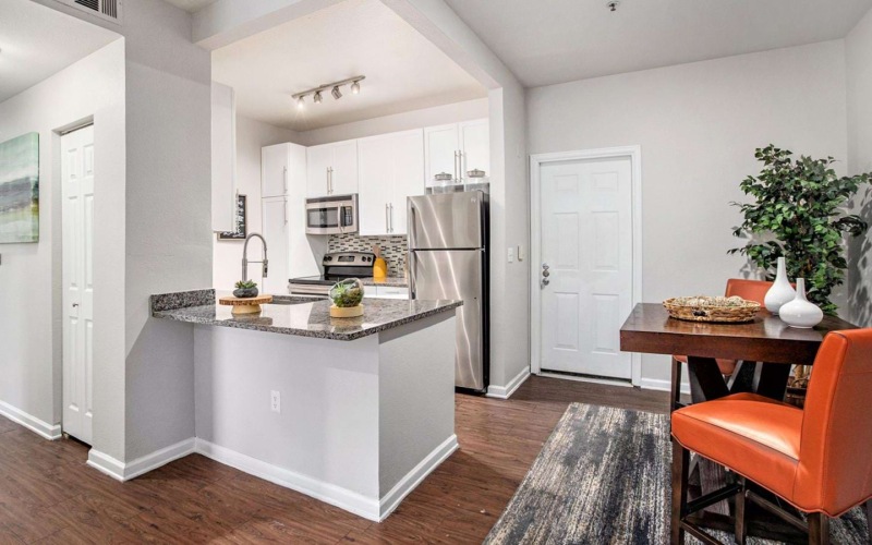 a kitchen with a table and chairs